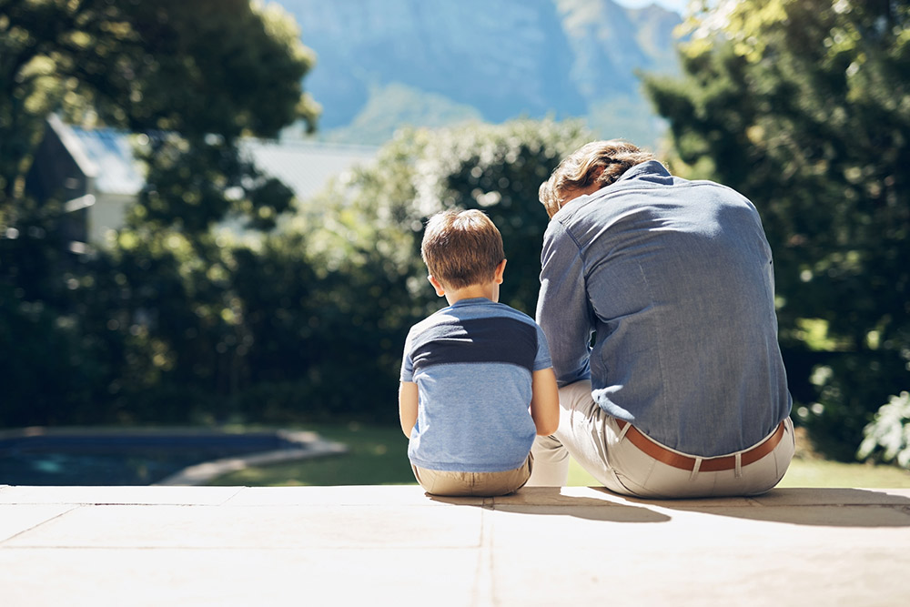 father and son sitting together