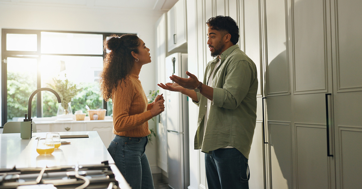 couple arguing in kitchen