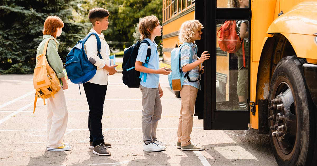 kids boarding a school bus